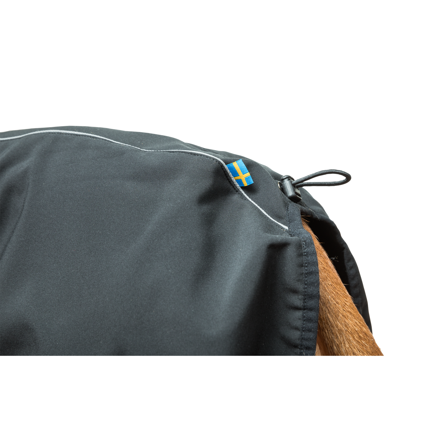 black fitted dog rug, reflective details and high collar, close up photo of tail detail