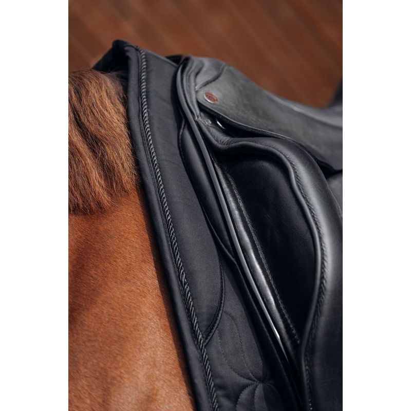 close up detail of padded pad of black dressage saddle pad