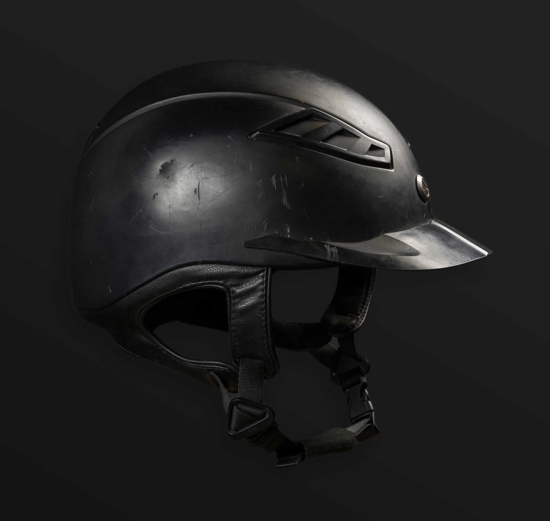 Black Lynx riding helmet with damage from fall