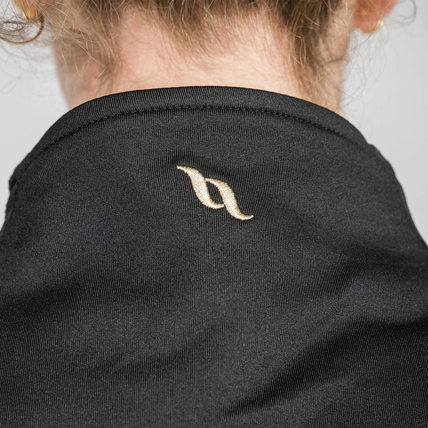 close up of logo detail on neck cover