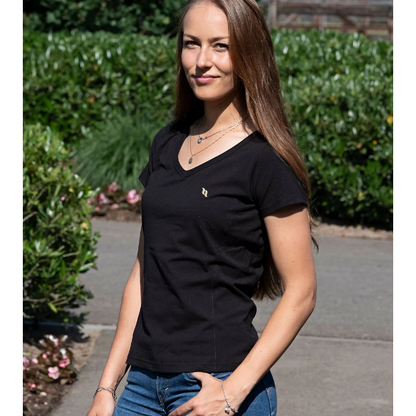 a black v-neck shirt being worn by women