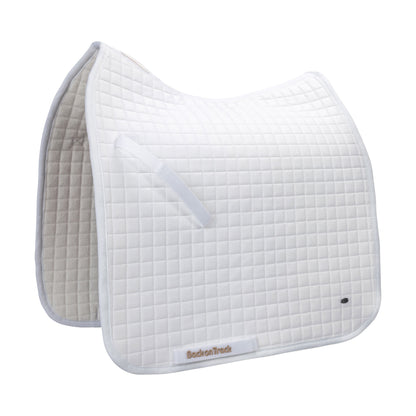 white dressage saddle pad with gold BOT and metal logo tag