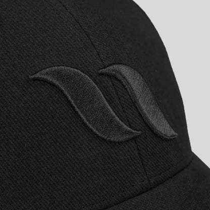 close up of logo detail on black cap