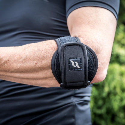 man wearing a tennis elbow strap