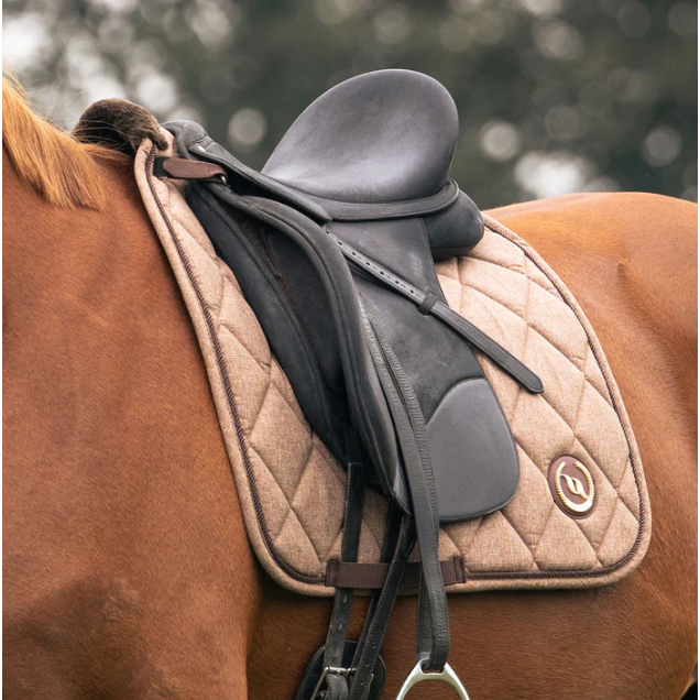 brown quilted dressage saddle pad with logo on horse