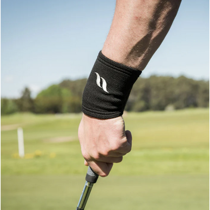 black wrist brace with back on track logo, worn by golfer