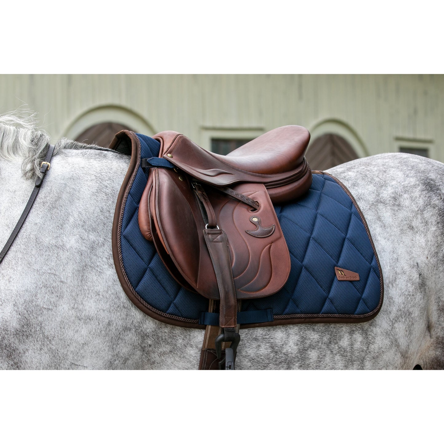 Navy saddle pad on grey horse, mesh, airflow, breathable