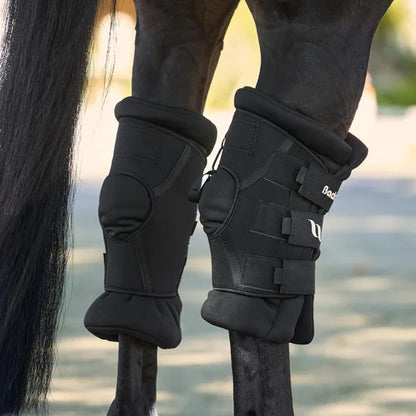 Horse wearing deluxe hock boots on both legs - rear view