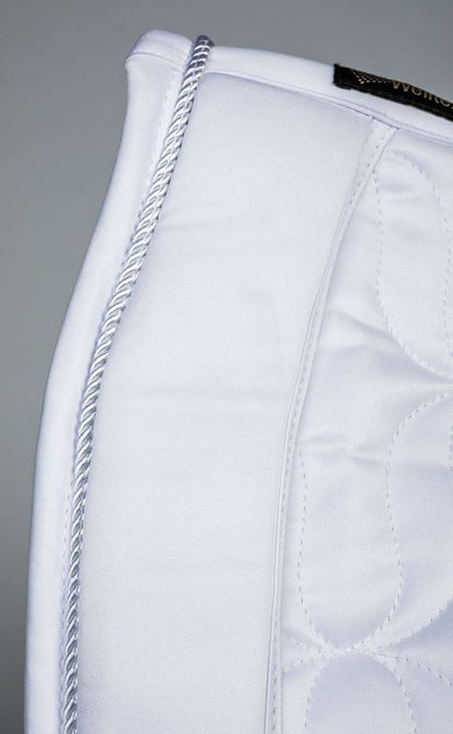 close detail of white saddle pad